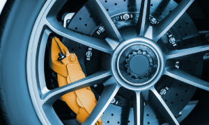 Technician inspecting underbody on lift